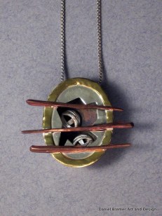 Caged pendant; sterling silver, copper, brass
